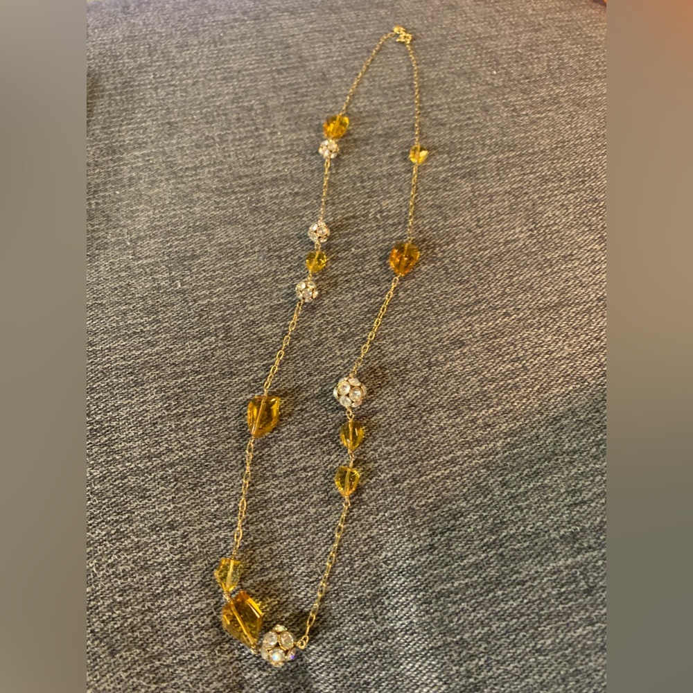 J Crew long gold necklace with rhinestones and amber colored beads.